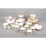 A Royal Albert Old Country Roses tea set including cake stand, tea pot, serving plates and more. One