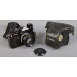 A Canon F-1 SLR camera with Canon FD 50mm 1:1.4 S.S.C lens and original case.