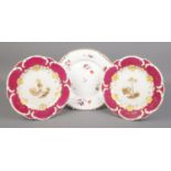 Three Rockingham porcelain plates. Includes two dessert plates with C-scroll moulded borders and