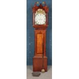 An oak and mahogany longcase clock, with barley twist features and swan neck pediment. Dial for SJ