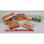 A collection of treen including decorative boxes, travel chess set and woodwind instrument.