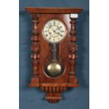 Gustav Becker mahogany wall clock with glazed pendulum display. Damage to face enamel cracked and