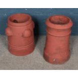 A pair of terracotta chimney pots tallest at 48cm
