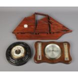 A Winter & Sons aneroid wall barometer along with similar barometer and wall clock formed as a ship.