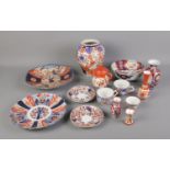 A collection of oriental ceramics including Imari pattern vase, bowl, plates, etc.