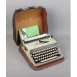 Remington Monarch type writer in travel case and manual.