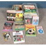 Two boxes of sporting annuals and books. Includes mostly football, George Best Soccer Annual, etc.