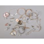 A collection of costume jewellery bracelets, bangles and pendants including floral and sunburst