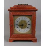 A mahogany cased mantle clock with top bracket and Arabic numeral dial. Movement stamped for FHS,