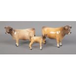 A Beswick Jersey cow trio including CH. Newton Tinkle, Dunsley Coyboy and calf. Glaze worn on back