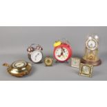 An assortment of mantle and alarm clocks, to include torsion and Bradley Mickey mouse alarm