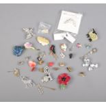 Over 30 costume jewellery brooches, pins and pendants including many animal themed examples.