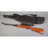A Snow Peak .22 calibre under lever air rifle with Optik 3-9x40 telescopic sight and carry case. CAN