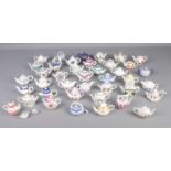 A large collection of Porcelain Art miniature teapots.