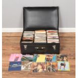A suitcase containing vinyl singles of mainly pop and easy listening to include ()