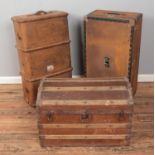 Vintage steamer trunk along with dome top example and other travel trunk.