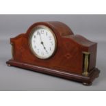 An Edwardian inlaid mahogany mantel clock. Having French movement.