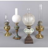 Four oil lamps with glass shades, one converted to electric with other duplex examples. Chips