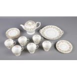 A Shelley "Wine Grape" design tea set with tea cups and saucers, serving plates and tea pot. Missing