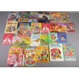 A quantity of Superhero and Disney books and annuals. Includes The Amazing Spiderman, Superman,