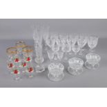 A large collection of cut and pressed glass including desert dishes, wine glasses, champagne flutes,