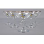 A set of six vintage Babycham glasses with gilt rim.