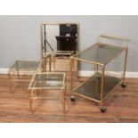 A yellow metal and glass Art Deco style furniture set including two tier hostess trolley, pair of