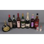 A collection of assorted alcohol including Cockburn's Fine Ruby port, Mateus Rose, Spanish Claret,
