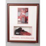 A signed Michael Schumacher right Fila shoe mounted in display case along with photograph. Approx.