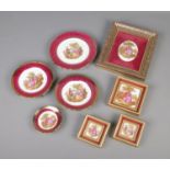 A collection of Limoges ceramics including plates and framed ceramics.