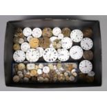 A box of pocket watch and wristwatch faces and movements, to include examples from Omega, Tudor