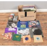 A box of assorted vinyl records and singles of mainly pop and easy listening to include Madonna,