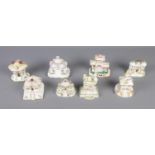 A collection of eight Coalport ceramic cottages including The Country Cottage, Jyrolean Castle,