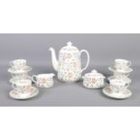 A Minton Haddon Hall six place tea service. To include cups and saucers, tea pot, sugar bowl and