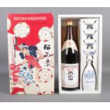 Sakura-Masamune; a cased set, to include sealed 720ml bottle, sake server and four cups.