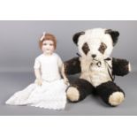 A large plush Giant Panda, together with an Armand Marseille mould 390 7Â½M doll. Stamped Germany