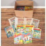 A box of comics. Includes Whizzer & Chips, Beezer, Buster, etc.