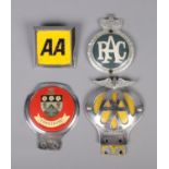 A collection of four car badges including AA, RAC and Yorkshire badges