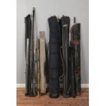 A large collection of assorted fishing equipment including selection of rods, nets, carry bags, etc.