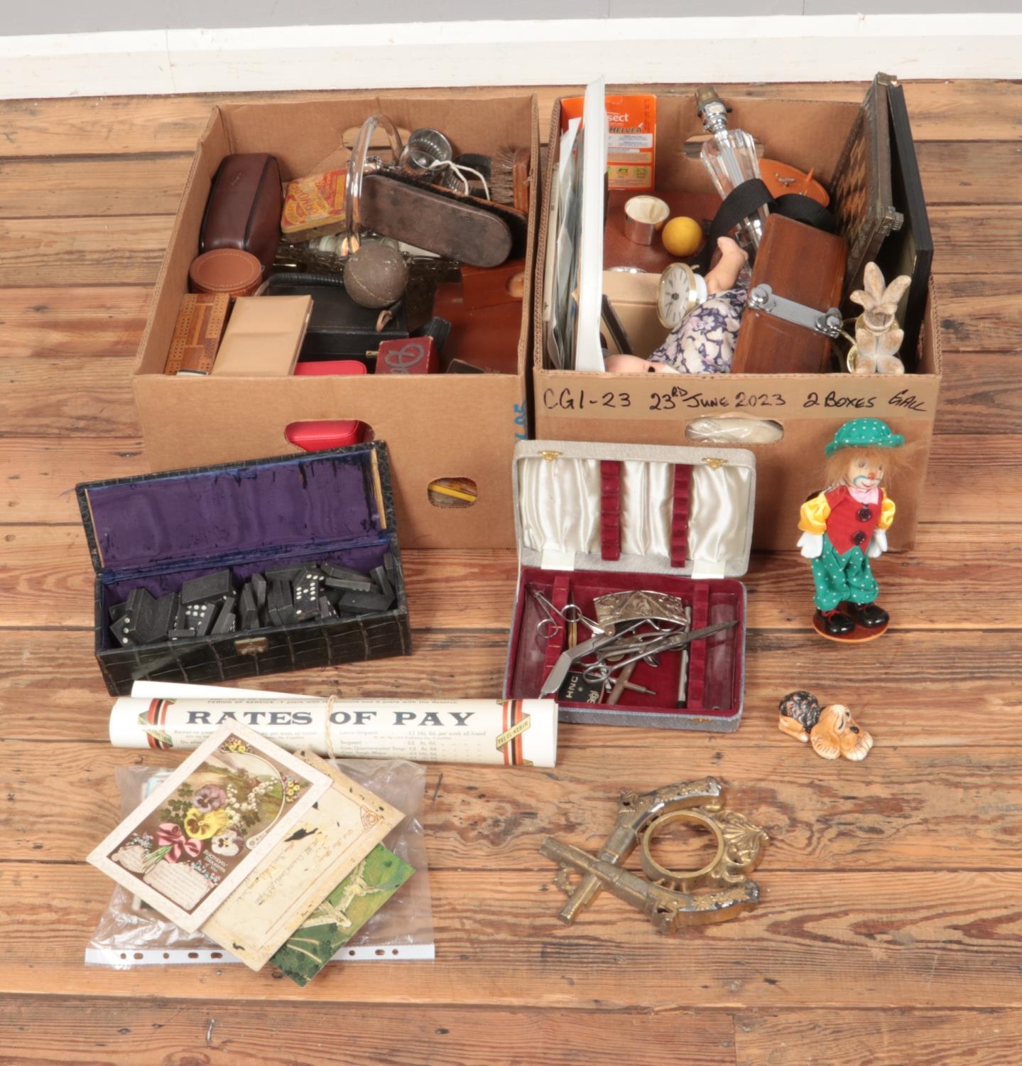 Two boxes of miscellaneous to include Pendelfin, glass table lamp, postcards, domino sets, etc.