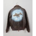 A reproduction Avirex Type A-2 US Air Force leather bomber jacket decorated with military aircraft