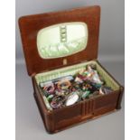 A oak Marco workbox with contents of costume jewellery. Includes bangles, beads, necklaces, ear