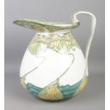 A Doulton Burslem 'Kelmscot' water jug, decorated with water lilies. Height: 23cm. Generally good