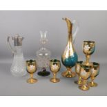 Three pieces of decorative glassware, to include a silver plate topped claret jug, gilt decorated