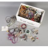 A large collection of assorted costume jewellery to include assorted necklaces, bracelets, earrings,