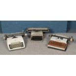 Three typewriters; Olivetti Lexikon 80, Smith-Corona Coronamatic 8000 and Olympia examples.
