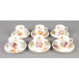 A Royal Doulton part tea service decorated with flowers and gilt edge. Approx. 12 pieces