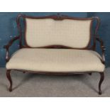 A Victorian carved mahogany upholstered parlour sofa. (93cm x 125cm x 54cm)
