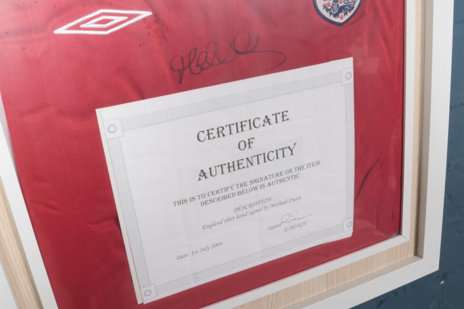 A framed England football shirt signed by Michael Owen with certificate of authentication - Image 2 of 2