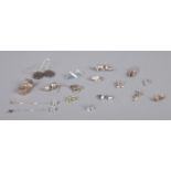 Sixteen pairs of silver earrings, to include studs, droplet and large polished stone examples. Total